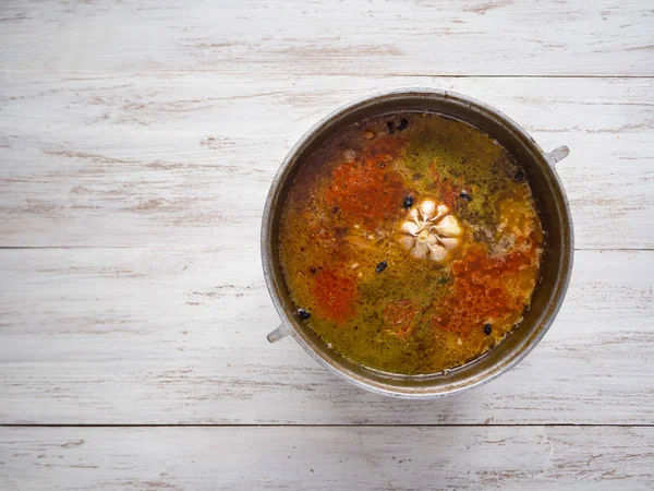 Cooking pilaf in a cauldron. Spices in pilaf. — Stock Image Cooking pilaf in a cauldron. Spices in pilaf. Stock Picture