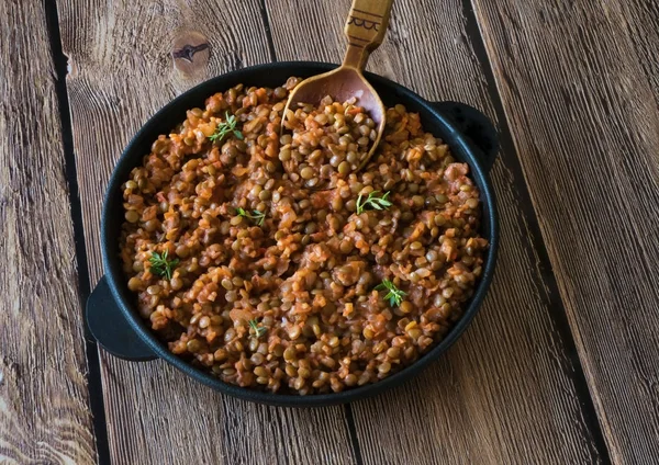 Stewed lentils with vegetables. Rustic food.