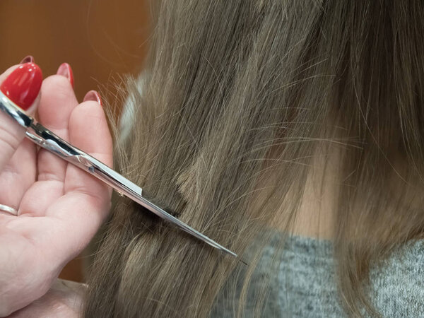 The technique of cutting with scissors. Close-up.