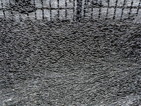 Spricka i glaset. Abstrakt bakgrund med spricka — Stockfoto