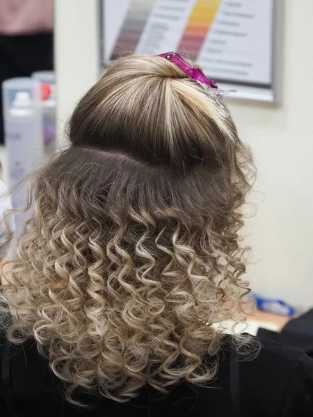 Hair wound on the Styler. Hair with curled curls. — Stock Photo, Image