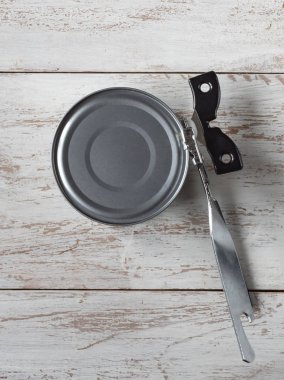 Canning knife opens the jar. Top view. 