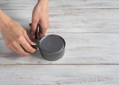 Canning knife opens the jar. Top view. 