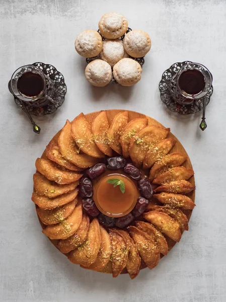 Arabic sweets. Arabian pancake stuffed with sweet cheese and pistachios