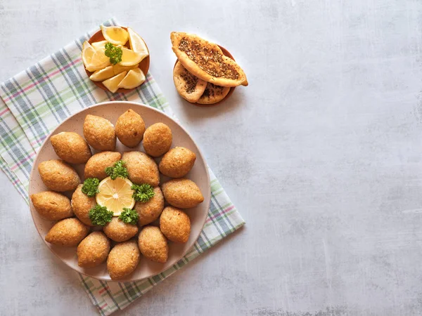 Arabic meat appetizer Kibbeh. Traditional Arabic kibbeh with lamb and pine nuts