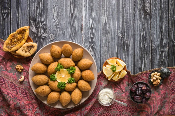 Arabic meat appetizer Kibbeh. Traditional Arabic kibbeh with lamb and pine nuts