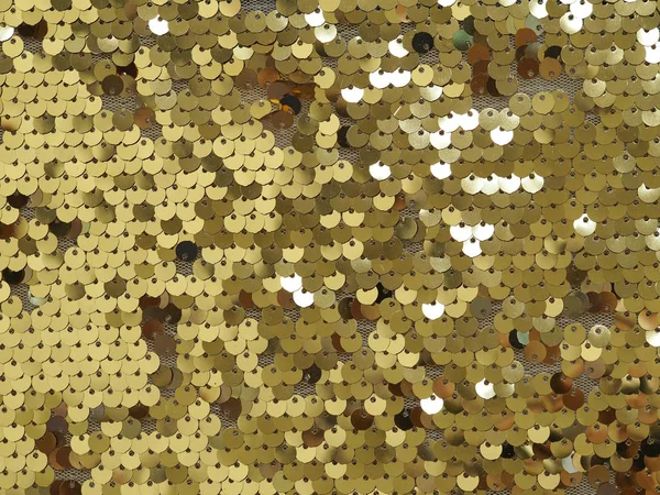 Fondo de lentejuelas brillantes de oro. De cerca. . —  Fotos de Stock
