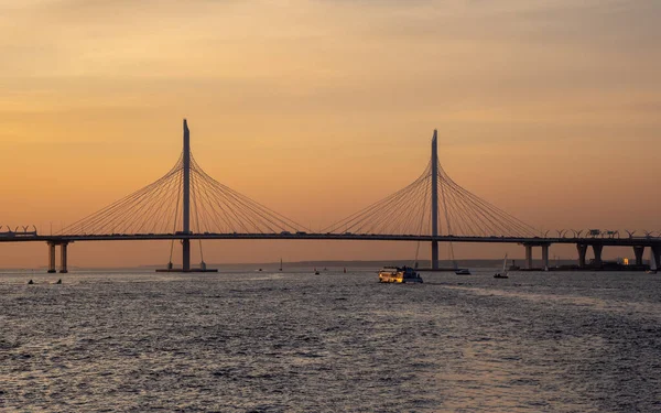 Small cable-stayed bridge of the Western high-speed diameter in Saint Petersburg at sunset