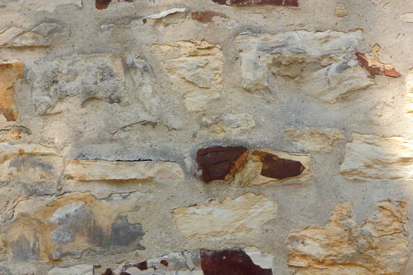古城墙的中世纪城市 在布拉格的一座古庙的墙上 石砌砖试验用水泥 空白为设计师 复古背景 — 图库照片