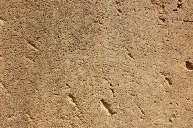 Doku duvar eski. Prag'da antik bir tapınak yüzeyine. Arka plan taş Tasarımcısı. Kahverengi tonlarında Vintage desen