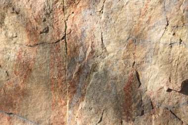 Granit doku. Granit taş yakın çekim. Arka plan doğal malzeme. Eski zamanların kayalık kayalar. Doğal desen