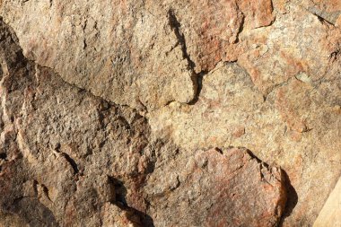 Granit arka plan. Granit taş yakın çekim. Doku doğal malzeme. Eski zamanların kayalık kayalar. Doğal desen