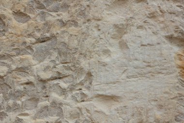 Taştan bir duvar dokusu. Antika arka plan. Ortaçağ binaları duvarına. Soyut desen doğal bir malzeme ile. Tasarım için boş