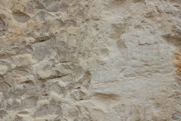 Taştan bir duvar dokusu. Antika arka plan. Ortaçağ binaları duvarına. Soyut desen doğal bir malzeme ile. Tasarım için boş