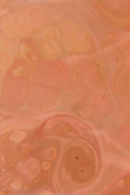 Sanat sıvı. Çok renkli arka plan üzerinde sıvı. Turuncu spot renkleri. Bulanık desen. Holografik doku