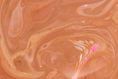 Sanat sıvı. Çok renkli arka plan. Turuncu spot renkleri. Bulanık desen. Sıvı üzerinde holografik doku