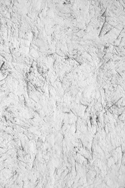 Beyaz doku. Beyaz duvar kökenli. Badana, kil duvar dokulu yüzeyi. Doğal malzeme ışık desen. Tasarımcı için boş