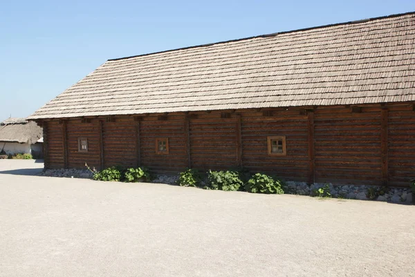 Wooden buildings. Wooden houses of Cossacks. Outbuildings at Zaporizhzhya Sich on island of Khortytsya in Ukraine. Medieval way of life — Stock Image Wooden Buildings Wooden Houses Cossacks Outbuildings Zaporizhzhya Sich Island Khortytsya Stock Image