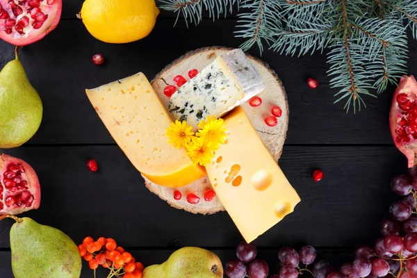 Various Types Cheese Fruits Dark Boards Christmas Tree Branches Swiss — Stock Photo, Image