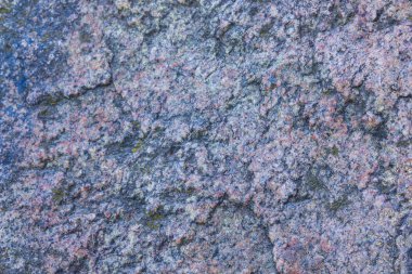 Granit doku kapatın. Gözenekli yüzey ile Granit kayalar. Sağlam taş kökenli. Doğal malzeme ile desen