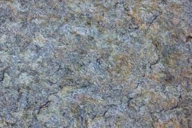 Granit doku kapatın. Gözenekli yüzey ile Granit kayalar. Sağlam taş kökenli. Doğal malzeme ile desen