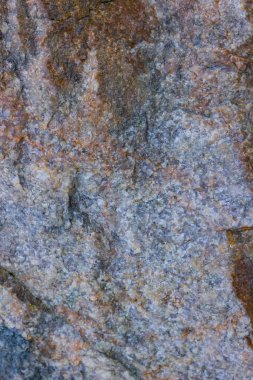 Granit doku kapatın. Gözenekli yüzey ile Granit kayalar. Sağlam taş kökenli. Doğal malzeme ile desen