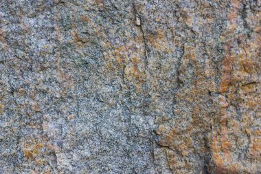 Granit doku kapatın. Gözenekli yüzey ile Granit kayalar. Sağlam taş kökenli. Doğal malzeme ile desen