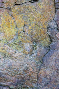 Granit doku kapatın. Gözenekli yüzey ile Granit kayalar. Sağlam taş kökenli. Doğal malzeme ile desen