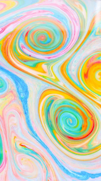 Fluid art with different colors. Screen saver. Multicolored background from paints on liquid. Bright pattern on liquid. Colored paint stains in pop art style
