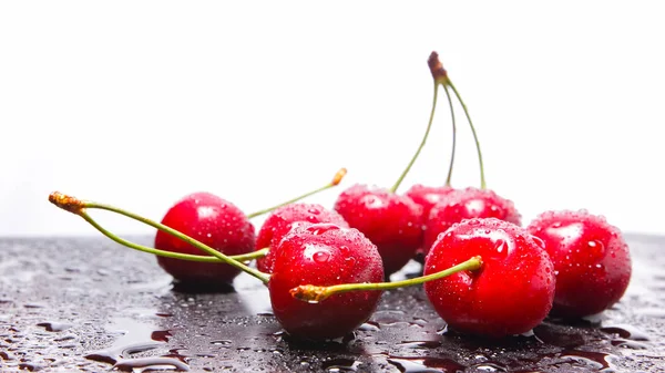 stock image Red cherries in water drops. Fresh cherries on dark background. Berries for vegan. Washed cherries before cooking