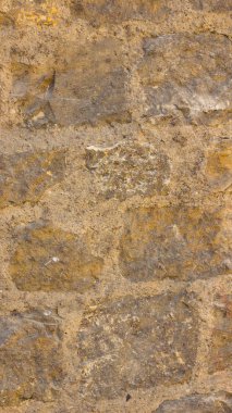 Eski taş duvarın arka planı. Taş yüzeyin dokusu. Eski Avrupa şehrinde tuğla işi. Retro stilinde desen