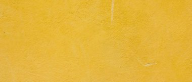 Altın taş yüzey dokusu. Altın renginde doğal arka plan. Retro tarzında taş duvar dokusu. Geniş ekran