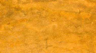 Altın taş yüzey dokusu. Altın renginde doğal arka plan. Retro tarzında taş duvar dokusu. Geniş ekran