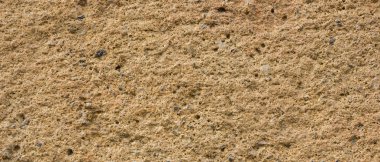 Eski duvarın arka planı. Taş yüzeyin dokusu. Retro tarzısoyut arka plan. Katı malzemenin kahverengi yüzeyi