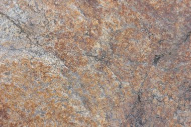 Granit taş dokusu. Granit in arka planı. Pürüzlü yüzey deseni. Kahverengi taş dokusu