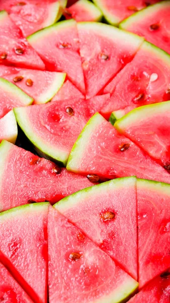 Watermelon pattern. Sliced watermelon with seed. Summer fruit background. Flat lay. Top view