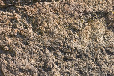 Granit in arka planı. Granit taş dokusu. Pürüzlü yüzey deseni. Kahverengi taş dokusu