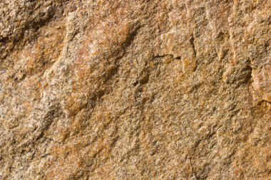 Granit in arka planı. Granit taş dokusu. Pürüzlü yüzey deseni. Kahverengi taş dokusu