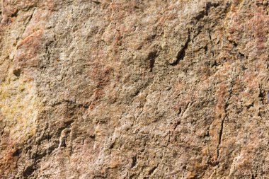 Granit in arka planı. Granit taş dokusu. Pürüzlü yüzey deseni. Kahverengi taş dokusu