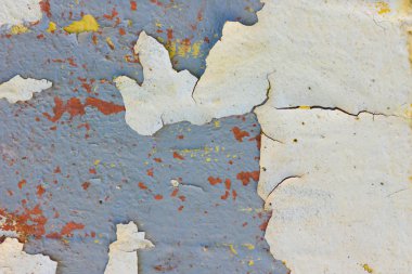 Çatlamış boyanın dokusu. Eski boyalı duvarın arka planı. Çatlak boya parçaları ile desen. Retro duvar kağıdı