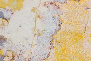 Çatlamış boyanın dokusu. Eski boyalı duvarın arka planı. Çatlak boya parçaları ile desen. Retro duvar kağıdı
