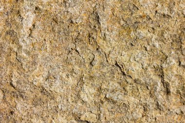 Granit in arka planı. Granit taş dokusu. Pürüzlü yüzey deseni. Kahverengi taş dokusu