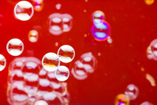 Abstract soap bubble background. Element for designers. Foam red bubble texture. Colorful bubbles float in the air