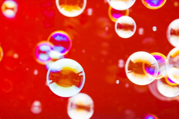 Abstract soap bubble background. Element for designers. Foam red bubble texture. Colorful bubbles float in the air