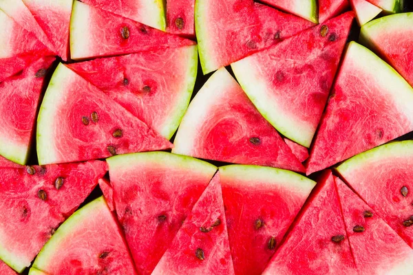 Karpuz deseni. Dilimlenmiş karpuz üst görünümü. Tohumlu olgun karpuz. Yaz yaratıcı kavramı