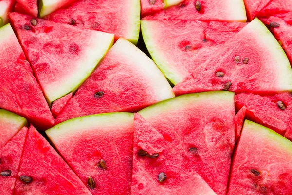 Karpuz deseni. Dilimlenmiş karpuz üst görünümü. Tohumlu olgun karpuz. Yaz yaratıcı kavramı