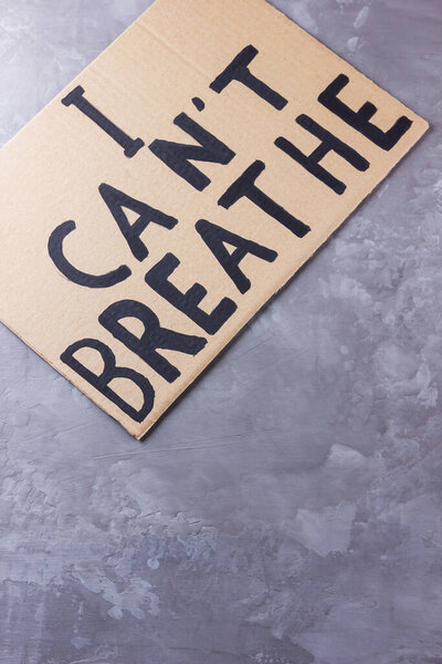 I Can't Breathe. Text message for protest action. Stop violence. Inscription "I Can't Breathe" on cardboard. Black lives matter concept on a gray background. Copy space