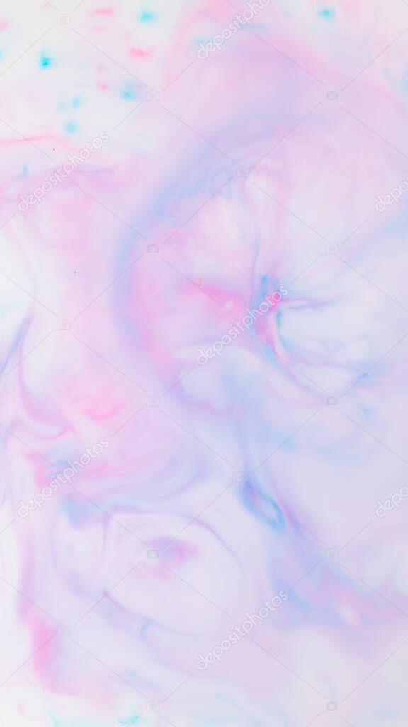 Fluid art texture. Pink blue background from liquid. Photography of colored spots on liquid. Abstract pattern