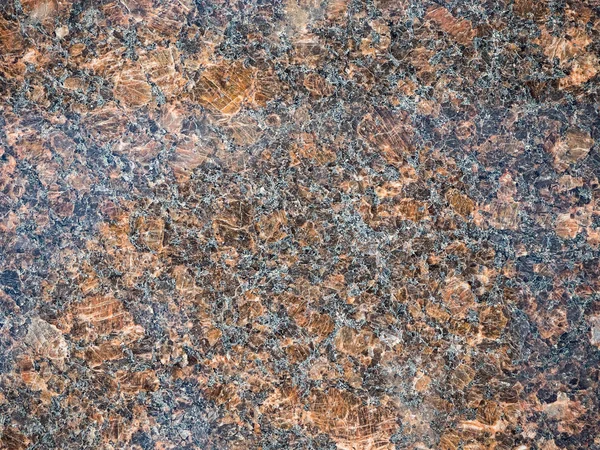 texture: gray granite surface with brown patches, stains and cra