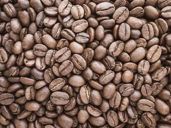 a lot of coffee beans medium roasted - food background